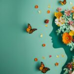 Ein kreatives Bild mit einem menschlichen Profil, das mit Blumen und Schmetterlingen verziert ist, symbolisiert emotionale Balance und wird durch SAM-e unterstützt.